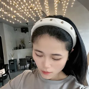 White padded headband for women with metallic cross stud details chic wide hair hoop accessory
