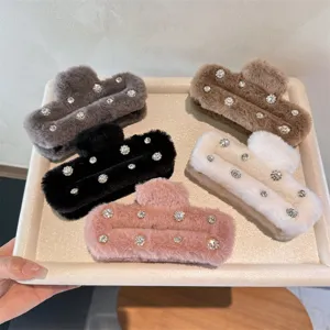 Detailed view of cozy plush rhinestone hair claws in various colors, stylish winter accessories.