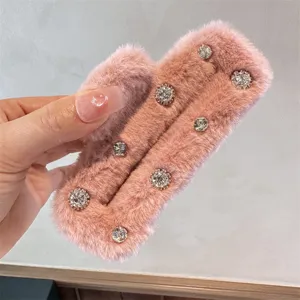 Pink plush hair claw clip with sparkly rhinestones, soft furry winter shark clip for styling.