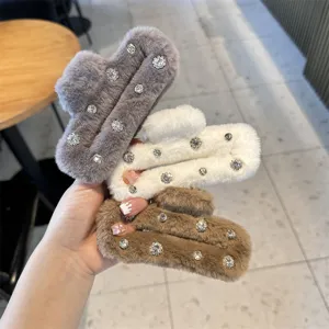 Fluffy square rhinestone hair claw clip detail, soft plush winter hair accessory style.
