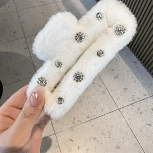 White plush square hair claw clip with sparkling rhinestones for elegant and lazy hairstyles.