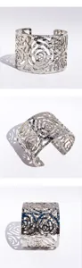 Wide silver hollow rose cuff bracelet with textured hammered finish, bold fashion wrist jewelry.