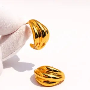 Chic gold-plated wave geometric statement earrings, trendy minimalist metal hoop jewelry.