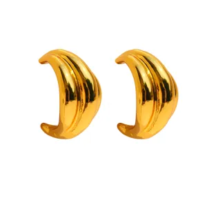 Chunky gold wave geometric statement earrings for women, stylish metallic crescent hoops.