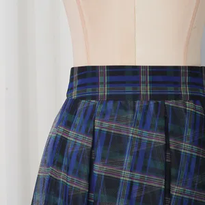 Blue plaid mesh skirt detail showcasing high waist design and fluffy pleated texture.