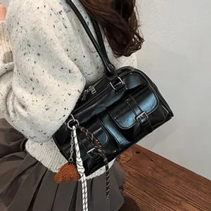 Black leather handbag for women, large capacity shoulder tote bag with vintage design and pockets.