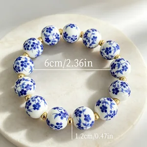 Nuevo pulsera de cerámica vintage china con cuentas de porcelana azul y espaciadores dorados.