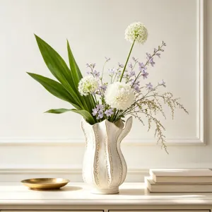 Detailed view of white ceramic art vase with vertical texture and floral arrangement display.