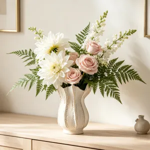 Creative white ceramic vase for home decor, elegant floral arrangement desktop display.