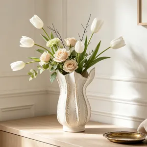 Detail shot of a creative white ceramic vase with elegant floral arrangement for home decor.