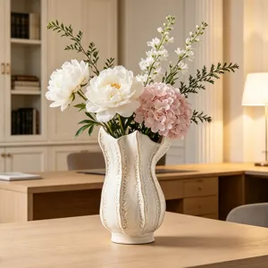 Detailed shot of a modern white ceramic vase with elegant floral arrangement for home decor.
