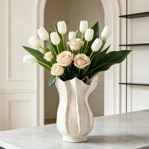 Creative white ceramic vase with white tulips and pink roses, elegant home decor accent.