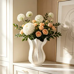 Decorative white ceramic vase with flower arrangement for home decor modern art display piece