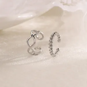 Silver non-pierced ear cuffs set featuring geometric and twisted wave designs for women.