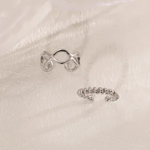 Silver color geometric double wave and twisted non-pierced ear cuffs pair for women.