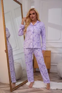 Details view of women long sleeve lapel cardigan pajama set with cute bow print in light purple.