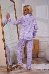 Women's long sleeve lapel button-down pajama set with cute purple bow and heart print.