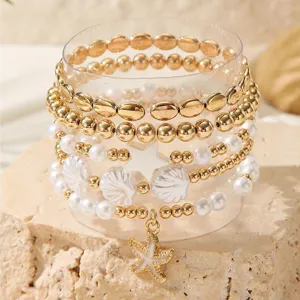 Stylish multi-layer pearl starfish beaded bracelet set for summer beach vacation style.