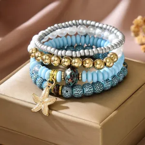 Multi-layer beaded bracelet set with starfish pendant for women, summer beach fashion jewelry.