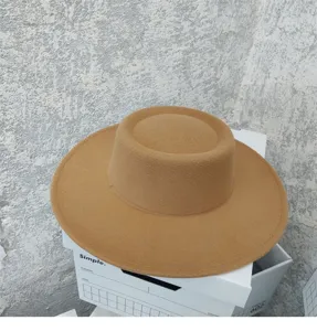 Detailed view of the wide brim flat top wool felt hat, vintage British style autumn winter.