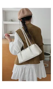 White retro underarm shoulder bag for women, stylish commute tubular bag, trendy daily design accessory.
