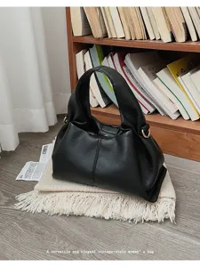 Vintage black pleated cloud shoulder bag, elegant commuting leather tote for women.