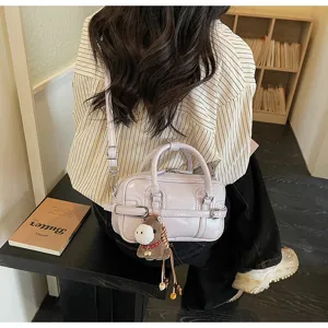Korean style chic purple handbag for women, casual shoulder and crossbody bag with cute pendant.