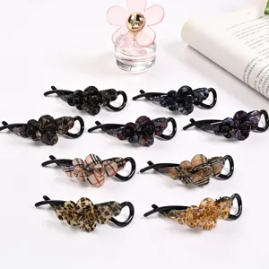 Acrylic hair claw clips for women, vintage twist hairpin and floral banana clip styling tools.