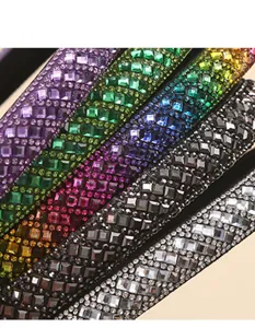Detailed close-up shot of dazzling crystal rhinestone padded headbands in various vibrant colors.