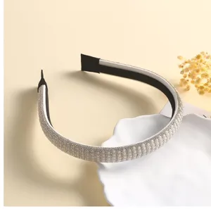 Elegant pearl rhinestone headband detail shot, sparkling hair accessory for women and girls.