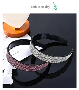 Detailed view of wide rhinestone headbands with sparkling crystal stones in silver and pink.