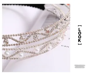 Detailed close-up of a luxury rhinestone and pearl headband, elegant multi-layer alloy hair hoop.