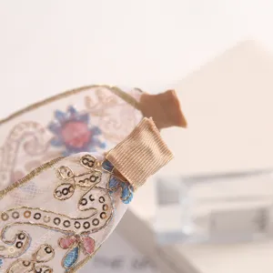 Exquisite embroidered mesh headband with gold threads and sparkling sequins for women elegance.