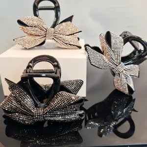 Rhinestone bow hair claw clip detail shot, sparkling crystal hair accessories for elegant styles.