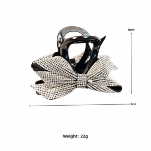 Elegant rhinestone bow hair claw clip for women, sparkling crystal hair accessory.
