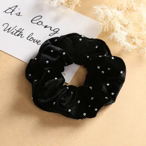 Black velvet hair scrunchie with sparkling rhinestones, elegant hair accessory for women.