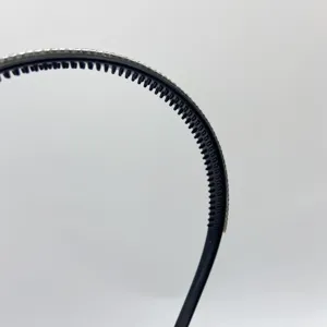 Rhinestone headband detail shot, black plastic hair hoop with sparkling crystals and teeth.