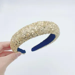 Gold sequin padded headband detail, high crown hair hoop close-up, sparkle fashion hair accessory