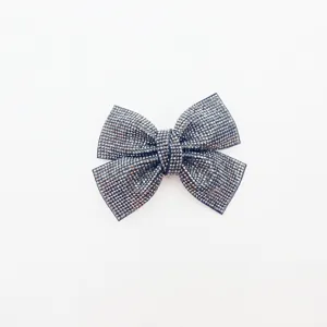 Rhinestone bow hair clip for women, sparkling crystal cross barrette, elegant grey hair accessory.