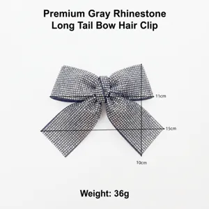 Detailed shot of sparkling grey rhinestone bow hair clip, featuring shimmering crystals.