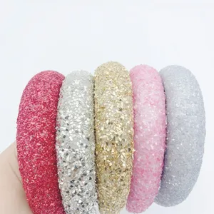 Detailed shot of handmade glitter padded headbands with colorful sequins for women fashion.