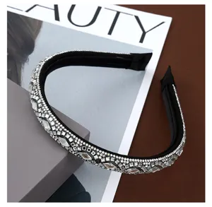 Close-up detail shot of sparkling rhinestone headband with elegant crystal diamond embellishments.