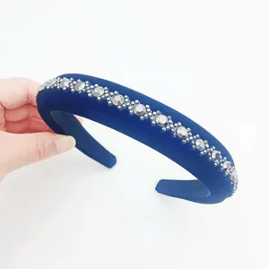 Detailed close-up view showing the elegant dark blue velvet rhinestone padded headband design.