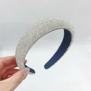 Sparkling rhinestone padded headband for women, stylish wide crystal hair hoop detail view.