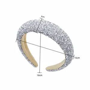 Detail view of a luxury sparkling rhinestone padded headband, exquisite crystal baroque design.