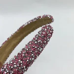 Detailed view of a sparkling pink rhinestone and silver studded headband for women daily wear.