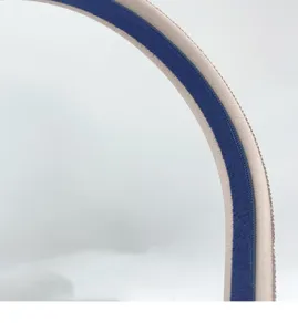 Detailed close-up of a chic rhinestone pearl headband featuring a stylish two-tone design.