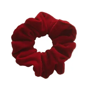 Red velvet hair scrunchie for women, soft elastic hair band, elegant holiday hair accessories.