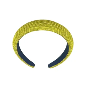 Detailed view of yellow rhinestone padded headband, sparkling crystal high crown hair hoop.