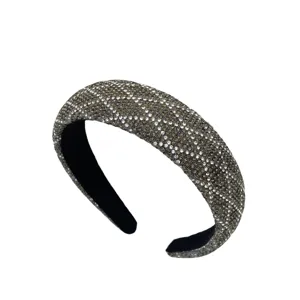 Rhinestone encrusted detailed view of the sparkly Baroque style sponge headband for women.